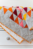 Warm Half-Square Triangle Throw Quilt