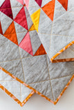 Warm Half-Square Triangle Throw Quilt