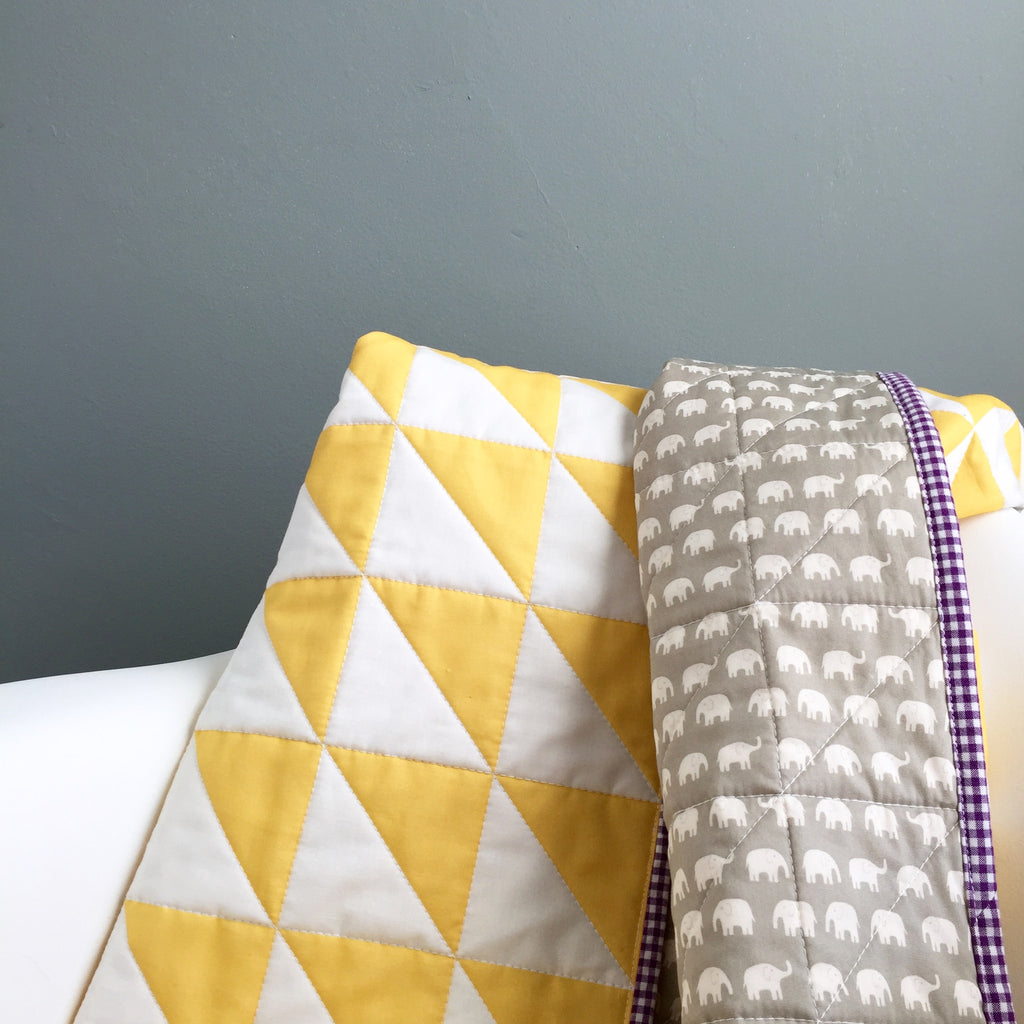 yellow-and-white whole-cloth baby quilt for a friend